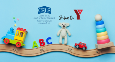Toys are on top of a wooden train track with the logos for the Centre for the Study of Living Standards and YMCA Shine On above them